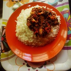 A picture of Boiled rice and vegetable stew.