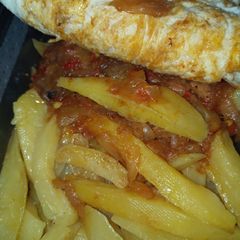 A picture of Chips with fried egg.