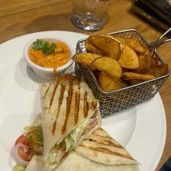 A picture of Fried potato with veg sandwich.