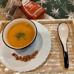 A picture of Peanut butter soup in white butter.