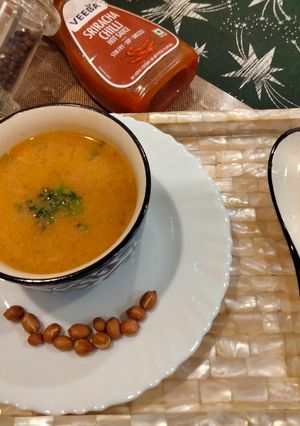 A picture of Peanut butter soup in white butter.