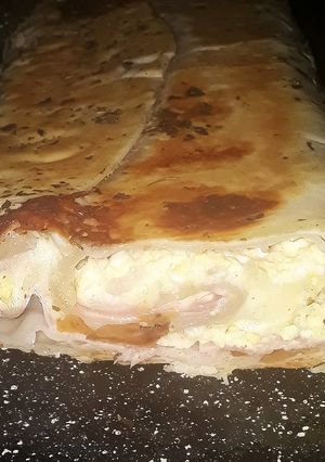 Una foto de Tarta arrollada de jamón, queso y huevo (pascualina)
