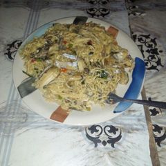 Indomie and kpalla fish A picture of Indomie and kpalla fish.