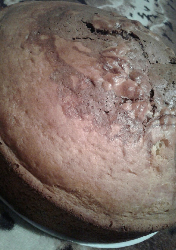 Una foto de Torta mármolada sabor naranja con centro de chocolate 😊