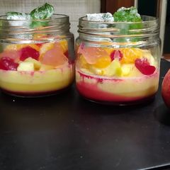 A picture of Basundi pennacota with fruits and fruit pulp jellies.