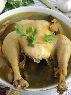 A picture of Fragrant Chicken Soup with spices and Corriander Leaves.
