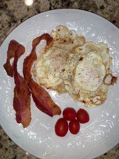 A picture of Over Easy Fried Eggs and Bacon.