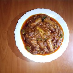A picture of Chicken sausage and green peppers curry 🫑🍅🐓.
