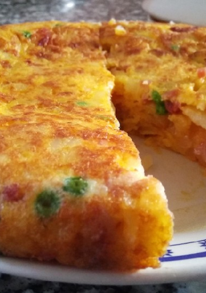 Una foto de Tortilla con chorizo y guisantes