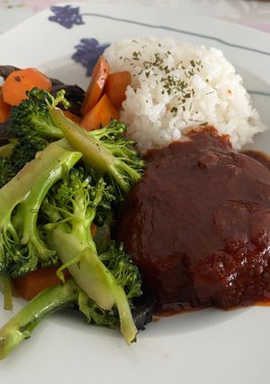 A picture of Meatless hambagu with mixed vegetables.