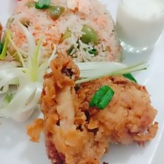 A picture of Chicken broast with vegetable rice.