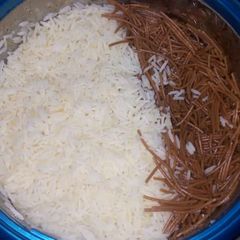 A picture of White rice with brown spagetti.