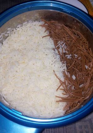 A picture of White rice with brown spagetti.