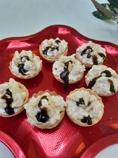 Una foto de Tartaletas de queso gorgonzola y pera
