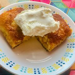 A picture of Apple pie leftover filling in crispy bread served with Vanilla ice cream.