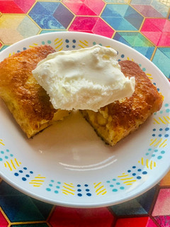 A picture of Apple pie leftover filling in crispy bread served with Vanilla ice cream.