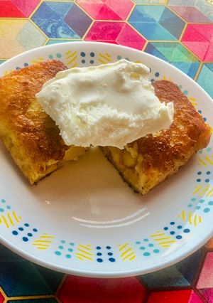 A picture of Apple pie leftover filling in crispy bread served with Vanilla ice cream.