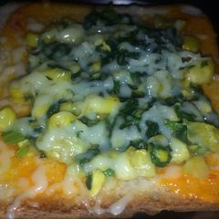 A picture of Spinach corn open sandwich.