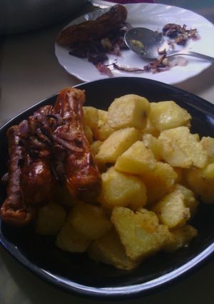 A picture of Baked Potatoes With Sausage and Caramelized Onions.