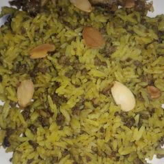 A picture of Jollof rice with miced beef.