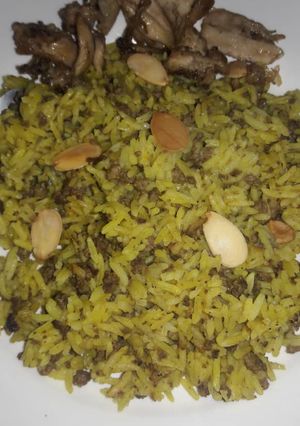 A picture of Jollof rice with miced beef.