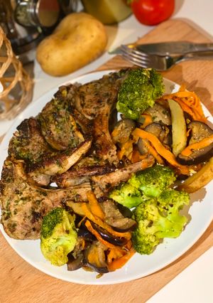 A picture of MARINATED LAMB CHOPS WITH FRESH CILANTRO & SAUTÉED VEGETABLES.