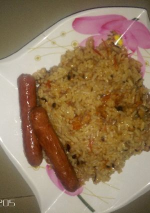 A picture of Rice and beans with sausage.