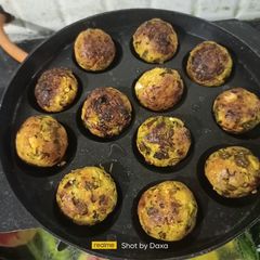 A picture of Suji Corn Cheese Balls In Appe Pan (Non Fried).