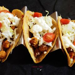 A picture of Soft tacos with soya and bean filling.