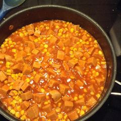 A picture of Spam and corn w/ tomato gravy.