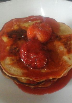 A picture of Vegan Pancakes with Strawberry sauce.
