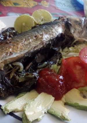 Una foto de Pescado empapelado al horno
