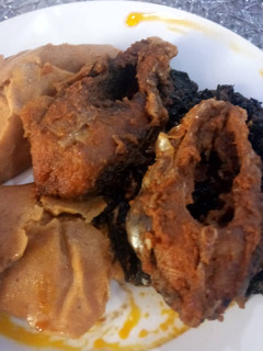 A picture of Moimoi with fried fish.
