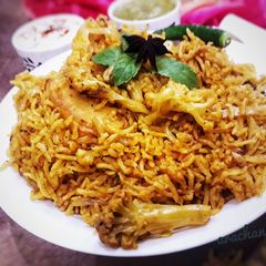 A picture of Veg tahari in pressure cooker.