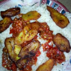 A picture of White rice,fish sauce and fried plantain.