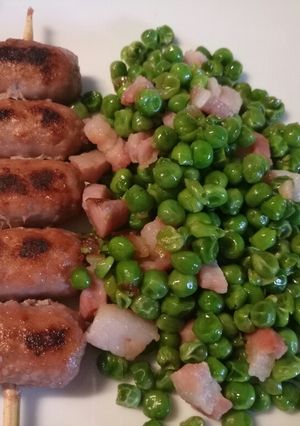 A picture of Mini sausage skewers with pancetta and peas.