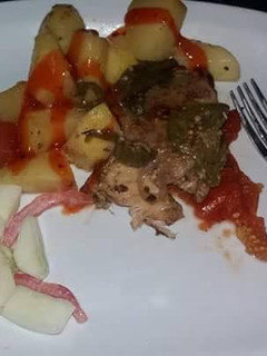 A picture of Deep fried chicken with deep fried potatoes.