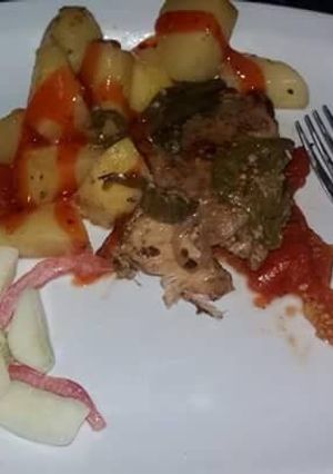 A picture of Deep fried chicken with deep fried potatoes.