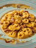 Τορτελίνια αλά κρεμ με κάρι και ψιλοκομμένο μπέικον