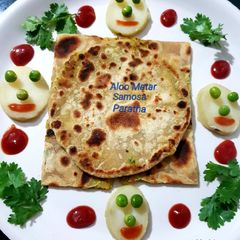 A picture of Aloo Matar Samosa Paratha.