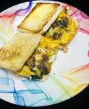 Mushroom, spinach, egg omelette sandwich