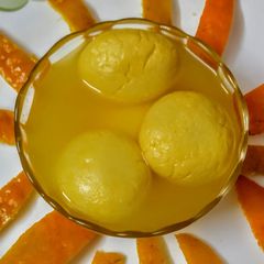 A picture of Orange rasogolla.