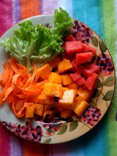 A picture of Papaya, lettuce, melon salad.