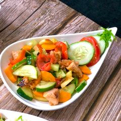 A picture of Chicken salad with orange dressing.