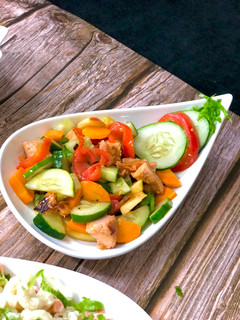 A picture of Chicken salad with orange dressing.