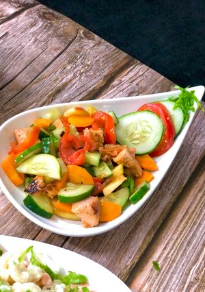 A picture of Chicken salad with orange dressing.