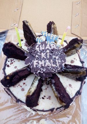 A picture of Chocolate cake with peanut butter frosting topped with Caramelised cake slices.