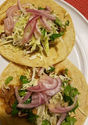 Una foto de Tacos de carne con jugo