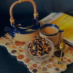 A picture of Black rice, dry fruits in honey.