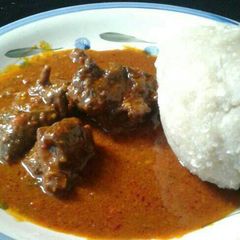 A picture of Plain ogbono soup and goat meat.